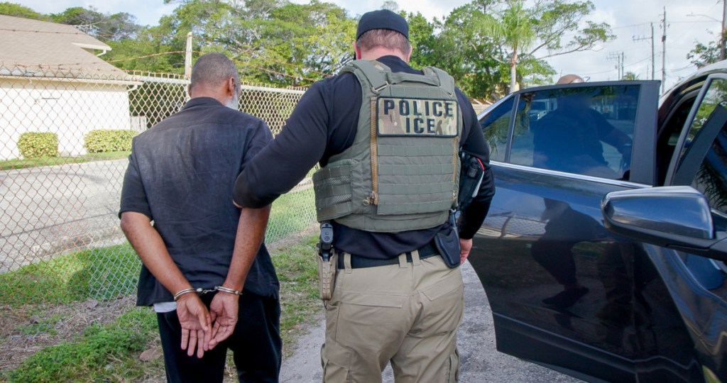 A U.S. Immigration and Customs Enforcement officers arrests a man during a 2025 initiative in West Palm Beach, Florida.